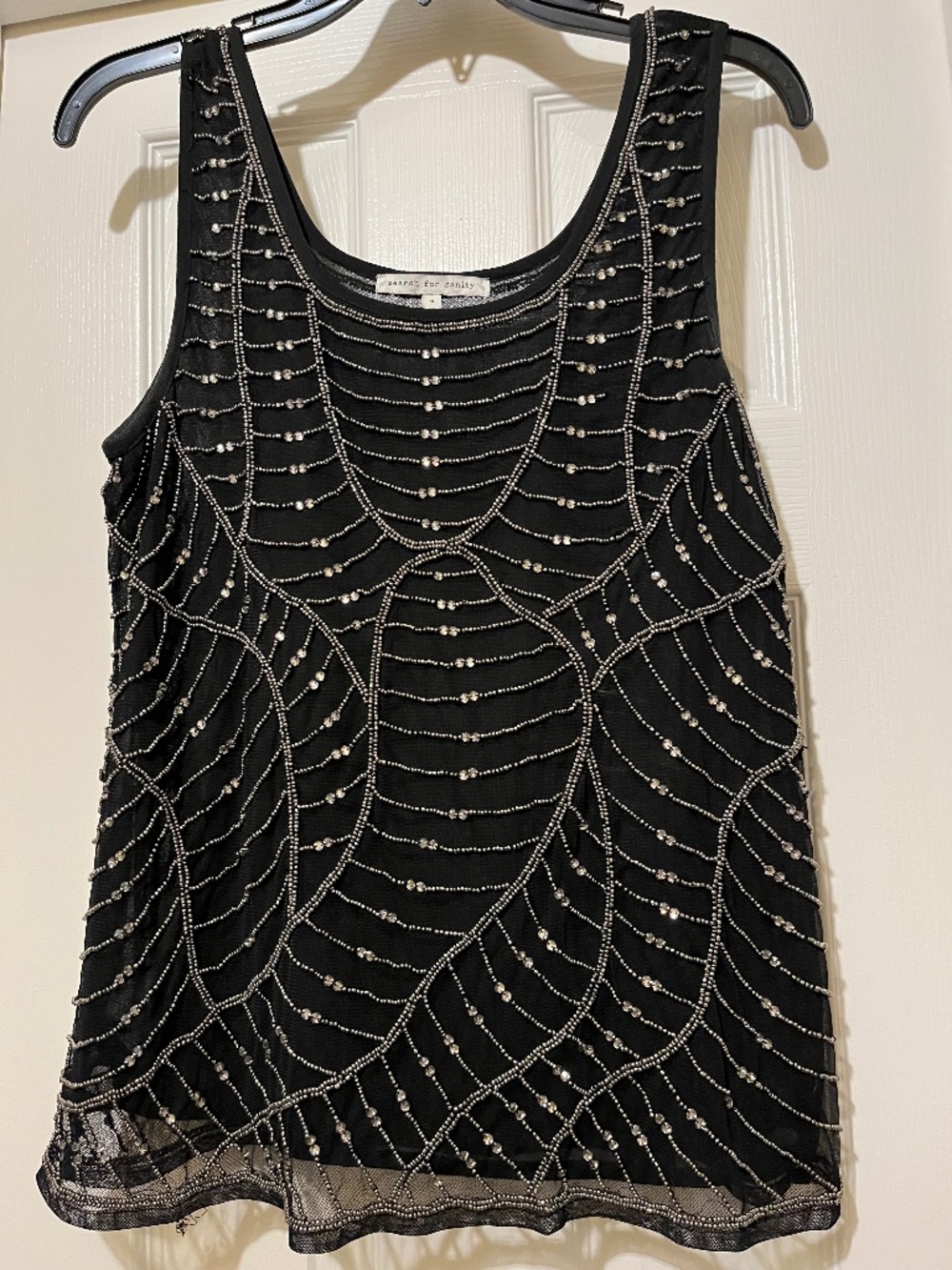 Black and silver sleeveless beaded top by Search for Sanity, size medium.